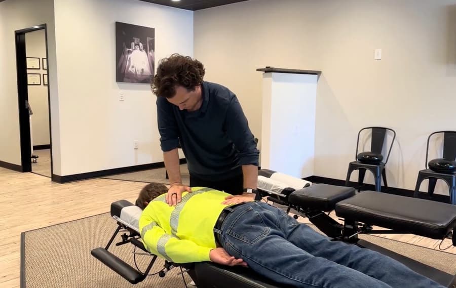 Dr. Brock Martin performing a gentle chiropractic adjustment